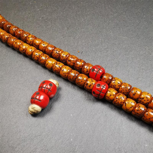 These marker beads were handmade by Tibetan craftsmen and come from Hepo Town, Baiyu County, the birthplace of the famous Tibetan handicrafts. It is made of plastic,carved skull pattern,red color,size is 0.4" × 0.3".