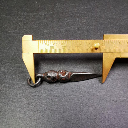 This phurba was made by Tibetan craftsmen and come from Hepo Town, Baiyu County,Tibet. Its upper part is Shmashana Adhipati skull, the lower part is a Dorje Phurba,and a copper dot inlaid on the waist of the phurba