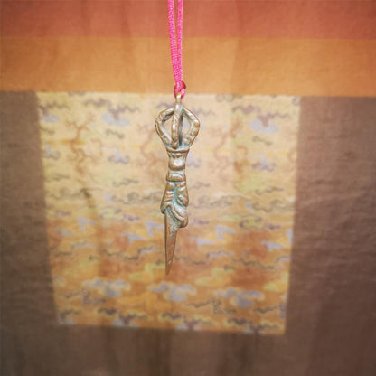 This vintage Phurba pendant was collected from gengqing Monastery(Derge,Tibet),handmade of copper. It is total 2.6 inches,brown color,on top of it is a dragon, the tail of the dragon is half vajra, from the dragon's mouth comes a phurba.