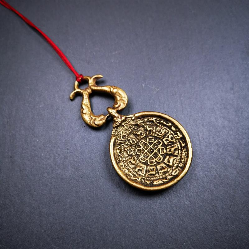This Sipaho amulet was made by Tibetan craftsmen and come from Hepo Town, Baiyu County, Tibet.  It is round shape,made of brass.Front pattern is Tibetan Budhist calendar symbol - SIPAHO(srid pa ho),the back is the gold fish and treasure vase symbol.
