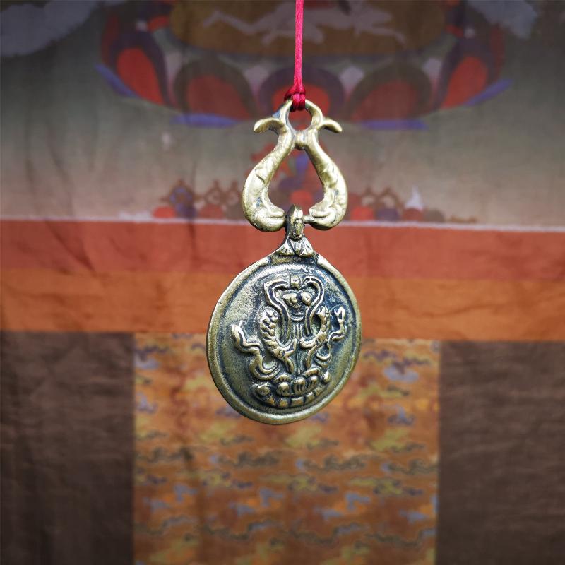 This Sipaho amulet was made by Tibetan craftsmen and come from Hepo Town, Baiyu County, Tibet.  It is round shape,made of brass.Front pattern is Tibetan Budhist calendar symbol - SIPAHO(srid pa ho),the back is the gold fish and treasure vase symbol.