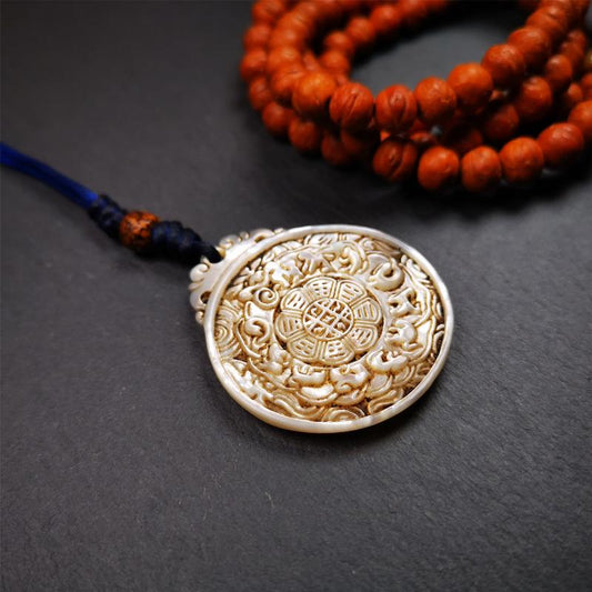 This unique Sipaho amulet was collected from  Derge Parkhang Tibet about 80 years old.  It was carved from shell,in different light and angles, it will emit unparalleled psychedelic colors.The front pattern is Tibetan Budhist calendar symbol - SIPAHO(srid pa ho),the back is cross vajra.
