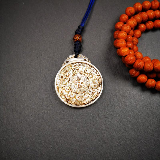 This unique Sipaho amulet was collected from  Derge Parkhang Tibet about 80 years old.  It was carved from shell,in different light and angles, it will emit unparalleled psychedelic colors.The front pattern is Tibetan Budhist calendar symbol - SIPAHO(srid pa ho),the back is cross vajra.