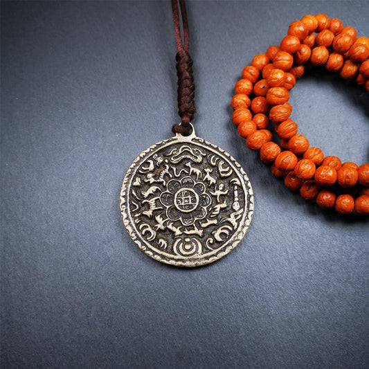 This unique Melong badge was collect from Kathok Monastery Tibet,about 60+ years old.It was sacred  amulets used by Kathok Monastery to present to believers,during a grand Dharma gathering,consecrated and blessed by lama.  It is made of thokcha,2.16 inch diameter,the front pattern is Tibetan Budhist calendar symbol - SIPAHO.