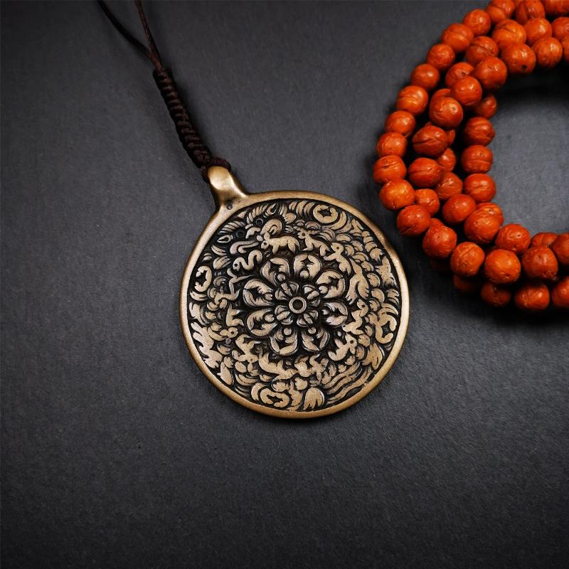 This unique meling amulet is handmade in Baiyu County Tibet,Where is the famous handicraft industry base in Tibetan areas.  It is made of lima brass,2.16 inches diameter,the front center is a very rare mandala flower shape.