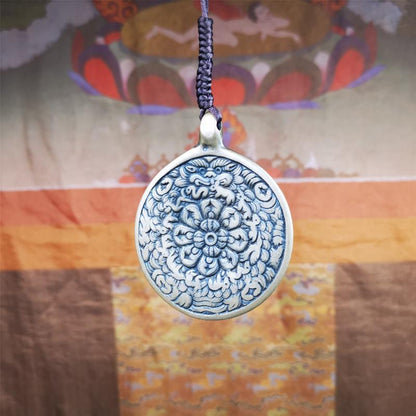 This unique meling amulet is handmade in Baiyu County Tibet,Where is the famous handicraft industry base in Tibetan areas.  It is made of lima brass,2.16 inches diameter,the front center is a very rare mandala flower shape.