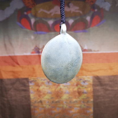 This unique meling amulet is handmade in Baiyu County Tibet,Where is the famous handicraft industry base in Tibetan areas.  It is made of lima brass,2.16 inches diameter,the front center is a very rare mandala flower shape.