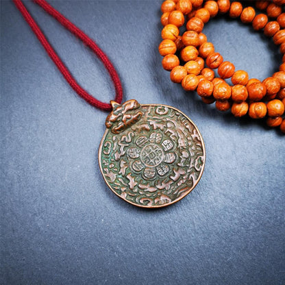 This unique melong badge was collected from Kathok Monastery for 50 years. It is round shape ,made of copper and carved 2 sided pattern. Its hanging ring is Kirtimukha,the fron is Tibetan Budhist calendar symbol - melong,and the back is mani jewel.