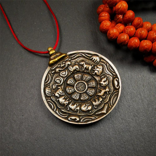 This melong calendar badge was collect from Kathok Monastery Tibet about 50+ years. This batch of melong are sacred  amulets used by Kathok Monastery to present to believers,consecrated and blessed by lama. It adopts a split casting method,1.89 inch.