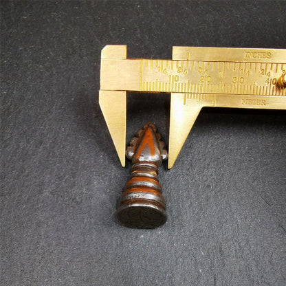 This mani jewel amulet was collect from Derge Tibet,it's an old amulet pandent, made of Cold Iron inlaid copper wire, the shape is Triratna symbol. Its base is engraved with the Tibetan letter of OM. You can make it into a necklace, or put it in your shrine.