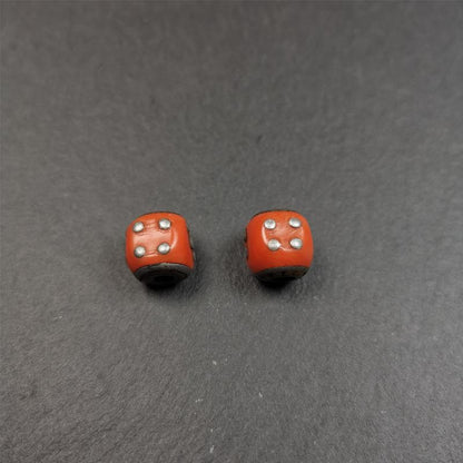 These marker beads were handmade by Tibetan craftsmen and come from Hepo Town, Baiyu County, the birthplace of the famous Tibetan handicrafts. It is made of plastic,inlaid cold iron,orange color,size is 0.47" × 0.47". Fit for 8-12mm mala (The reference in the photo is 8mm mala)