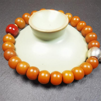 This mala was made by Tibetan craftsmen.  It is made of Corypha Linn Seeds, diameter of 10mm / 0.4",circumference is 22cm / 8.7" ,with agate spacer bead, end of a white copper guru bead.