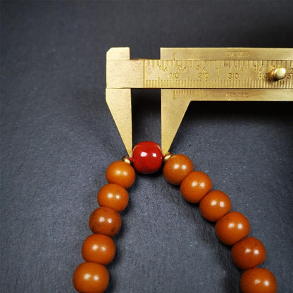 This mala was made by Tibetan craftsmen.  It is made of Corypha Linn Seeds, diameter of 10mm / 0.4",circumference is 22cm / 8.7" ,with agate spacer bead, end of a white copper guru bead.