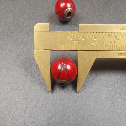 These marker beads were handmade by Tibetan craftsmen. It is made of plastic,inlaid copper and cold iron,red color,size is 0.6" × 0.6". Fit for 8-15mm mala (The reference in the photo is 8mm mala)