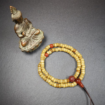 This yak bone mala was handmade from tibetan crafts man in Baiyu County,about 30 years old. It's composed of 108 pcs bevel cut 7mm bone beads,with agate beads,guru bead.