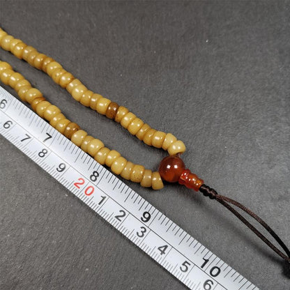 This yak bone mala was handmade from tibetan crafts man in Baiyu County,about 30 years old. It's composed of 108 pcs bevel cut 7mm bone beads,with agate beads,guru bead.