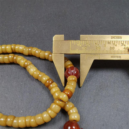 This yak bone mala was handmade from tibetan crafts man in Baiyu County,about 30 years old. It's composed of 108 pcs bevel cut 7mm bone beads,with agate beads,guru bead.