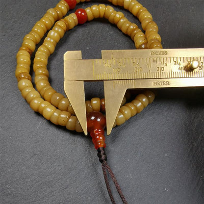 This yak bone mala was handmade from tibetan crafts man in Baiyu County,about 30 years old. It's composed of 108 pcs bevel cut 7mm bone beads,with agate beads,guru bead.