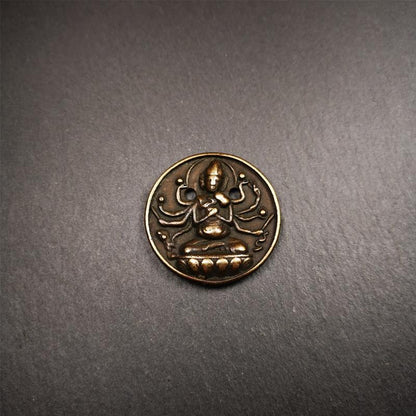 This Usnisa Vijaya statue was collected from Derge,Tibet. It's a badge or pendant,made of copper,brown color, 1.4 inch diameter. You can make it into a necklace,or bag hanging,or just put into your shrine.