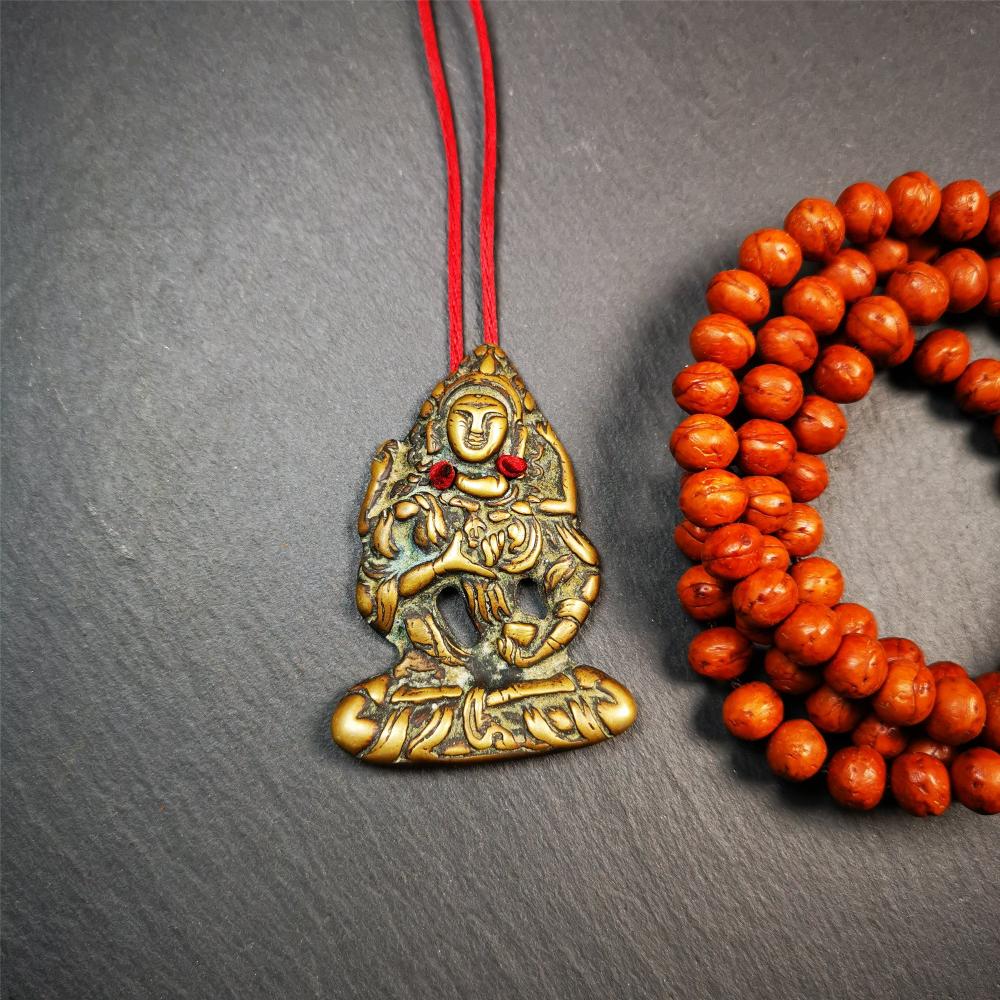 This Vajrasattva statue was collected from Derge,Tibet. It's a badge or pendant,made of copper,brown color, size is 2.24" × 1.57". You can make it into a necklace,or bag hanging