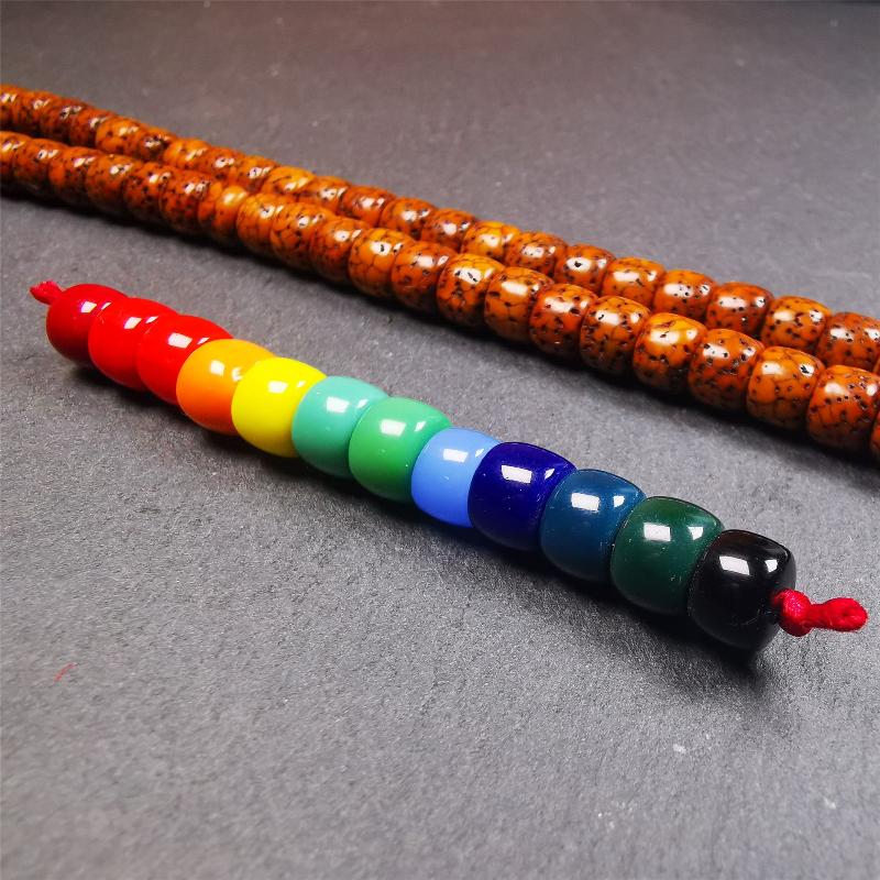 The price is 1 pair of 2 Strings Sherpa Glaze Beads,total 24 beads.(each string 12 beads)  These marker beads were handmade by Tibetan craftsmen and come from Hepo Town, Baiyu County, the birthplace of the famous Tibetan handicrafts. It is made of sherpa glaze,rainbow color,size is 0.31" × 0.24". Fit for 6-8mm mala (The reference in the photo is 8mm lotus seed mala)