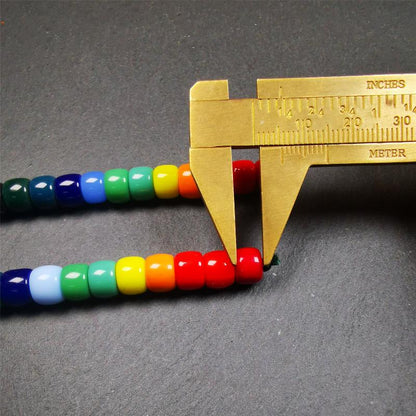 The price is 1 pair of 2 Strings Sherpa Glaze Beads,total 24 beads.(each string 12 beads)  These marker beads were handmade by Tibetan craftsmen and come from Hepo Town, Baiyu County, the birthplace of the famous Tibetan handicrafts. It is made of sherpa glaze,rainbow color,size is 0.31" × 0.24". Fit for 6-8mm mala (The reference in the photo is 8mm lotus seed mala)