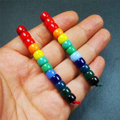 The price is 1 pair of 2 Strings Sherpa Glaze Beads,total 24 beads.(each string 12 beads)  These marker beads were handmade by Tibetan craftsmen and come from Hepo Town, Baiyu County, the birthplace of the famous Tibetan handicrafts. It is made of sherpa glaze,rainbow color,size is 0.31" × 0.24". Fit for 6-8mm mala (The reference in the photo is 8mm lotus seed mala)