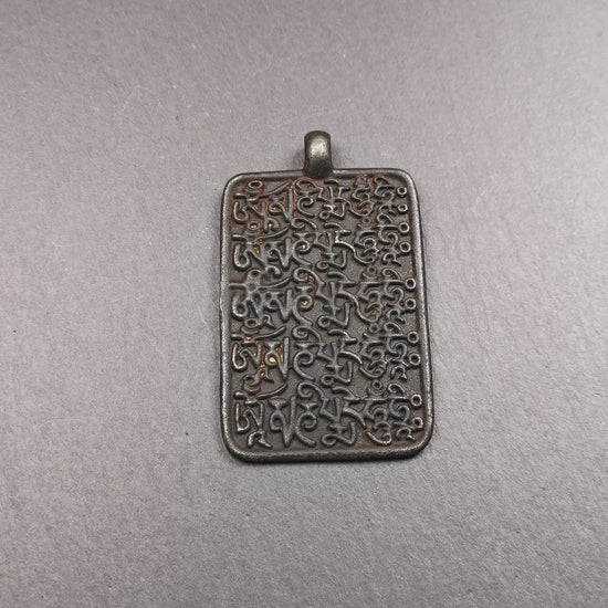 This badge is made by Tibetan craftsmen from Hepo Town, Baiyu County, the birthplace of the famous Tibetan handicrafts. It is made of copper, 2.52 × 1.57 inches. The front is the OM mantra and the back is body, speech, and mind.