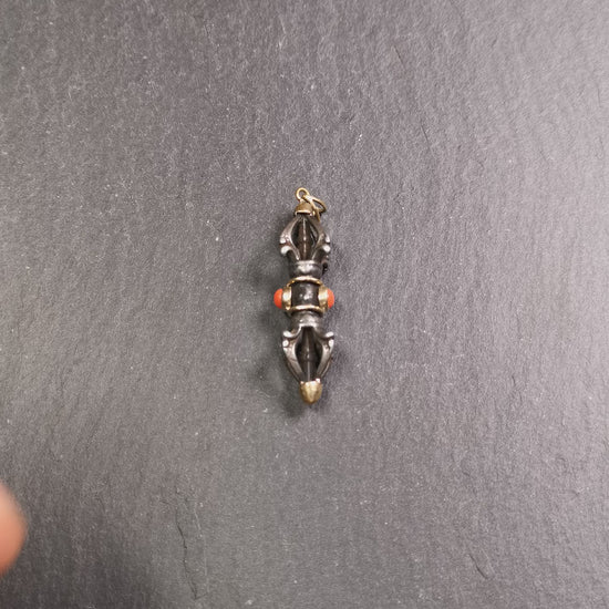 This unique vajra pendant was handmade by Tibetan craftsmen from Tibet in 1990's,from Hepo Town, Baiyu County, the birthplace of the famous Tibetan handicrafts. It is five-pronged Vajra,made of cold iron, 1.77 inch height.Comes with leather cord. You can make it a necklace, pendant, keychain, mala pendant, or just as an ornament on your desk.