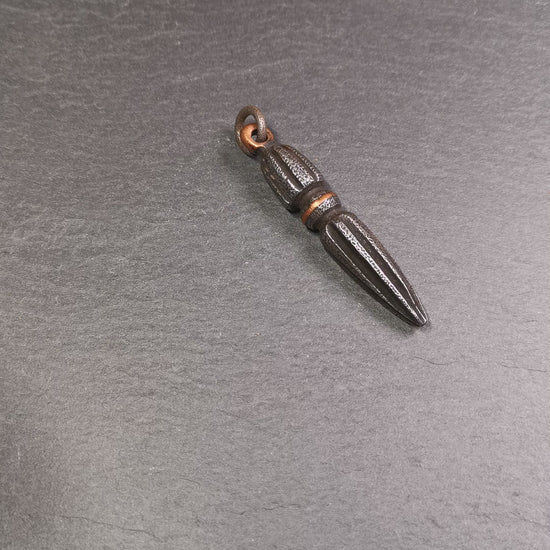 This handmade Dorje Phurba was crafted by Tibetan craftsmen from Hepo Town, Baiyu County, Tibet. The length is 2.5 inches,black color,the upper part is a vajra, and the lower part is a phurba. A copper wire is inlaid on the waist of the phurba.