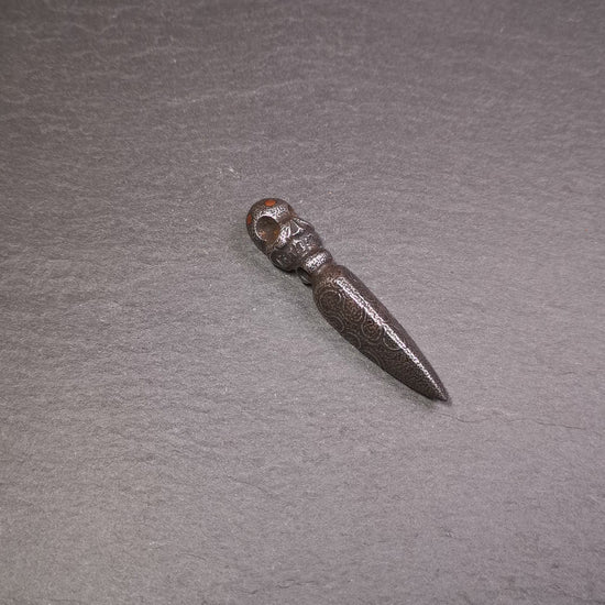 This phurba was made by Tibetan craftsmen and come from Hepo Town, Baiyu County, the birthplace of the famous Tibetan handicrafts. Its upper part is Shmashana Adhipati skull, the lower part is a Dorje Phurba, three copper dots inlaid on it